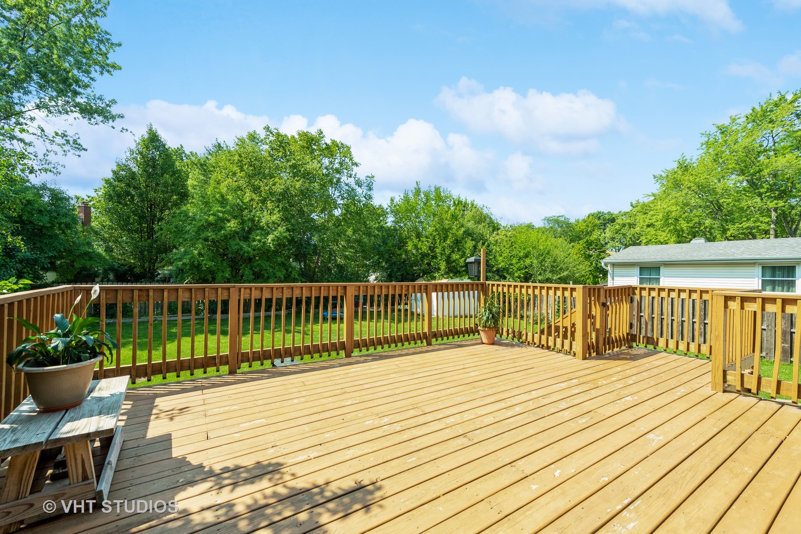 542 Weidner Road Buffalo Grove, IL 60089 - Photo 14 of 16 a balcony with potted plants and wooden fence