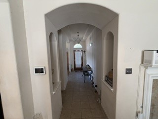 6720 Cromarty Lane Austin, TX 78754 - Photo 13 of 24 Step into this welcoming hallway, featuring archways that lead to other spaces.