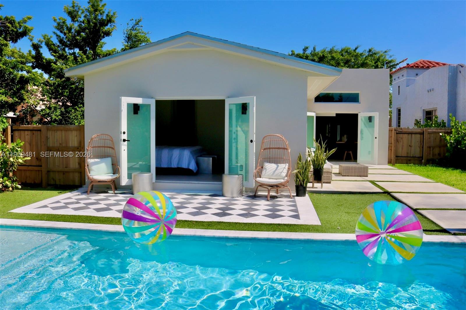 a view of pool table and chairs in patio
