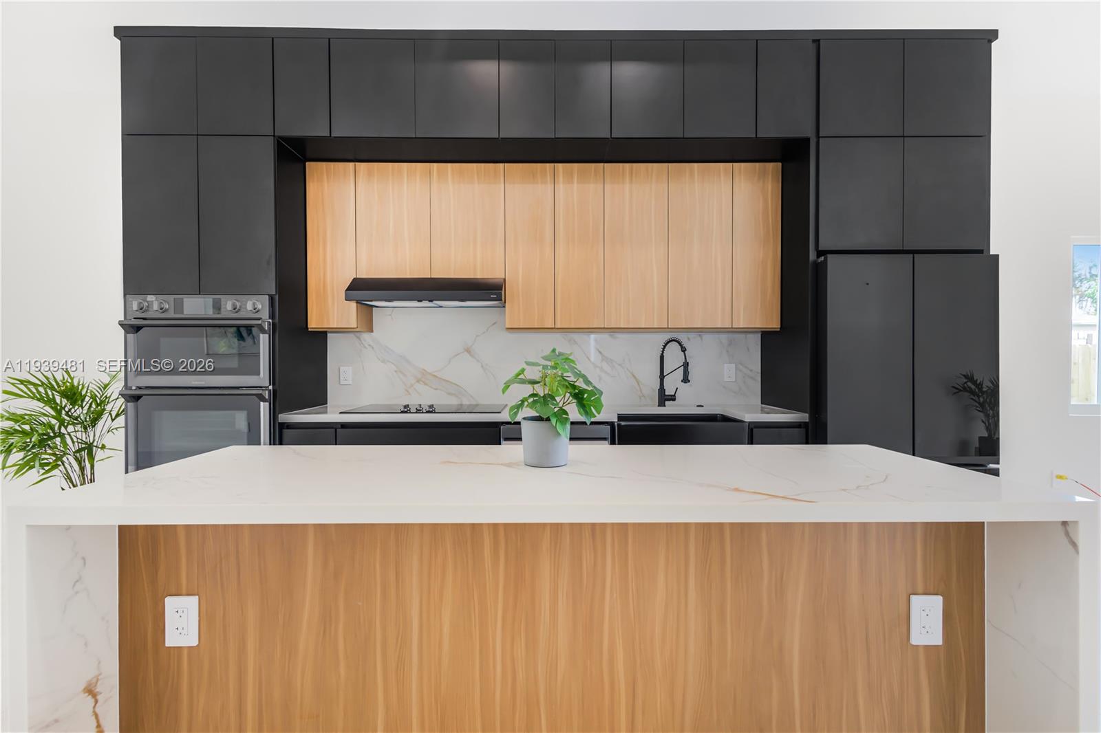 2975 Southwest 15th Street Miami, FL 33145 - Photo 14 of 27 a kitchen with a refrigerator and a white wall