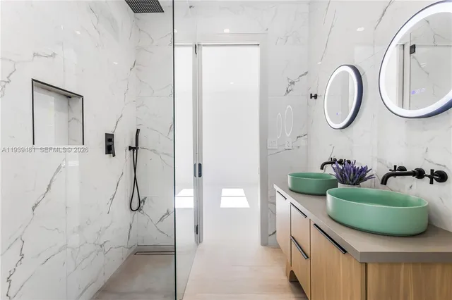 a bathroom with a double vanity sink and a mirror