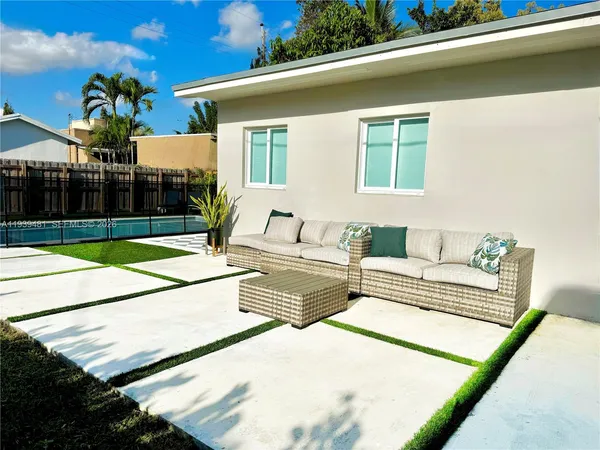 a front view of a house with outdoor space