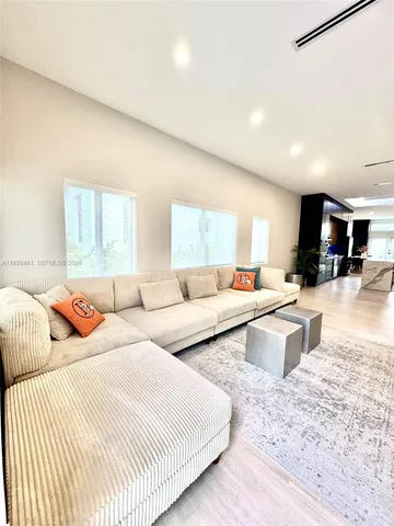 a bedroom with a large bed and a couch