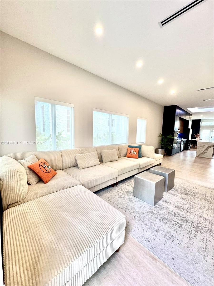 2975 Southwest 15th Street Miami, FL 33145 - Photo 5 of 27 a bedroom with a large bed and a couch