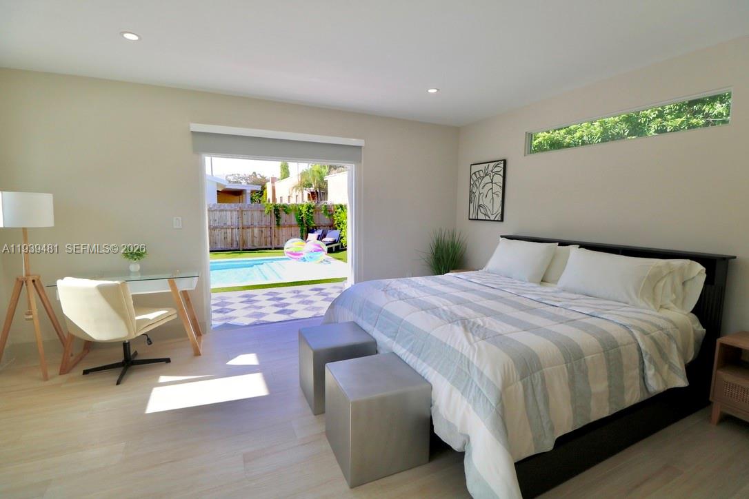 2975 Southwest 15th Street Miami, FL 33145 - Photo 8 of 27 a bedroom with a bed chair and window