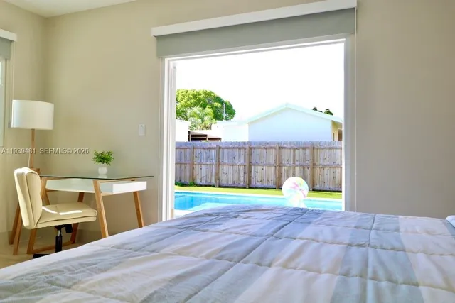 a bed room with a bed and a chair