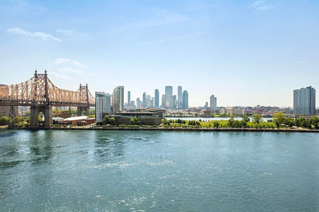 1 Sutton Place South, Unit 7C Manhattan, NY 10022 - Photo 12 of 16 a view of a city with lake