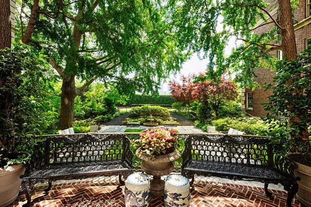 a view of a backyard with sitting area