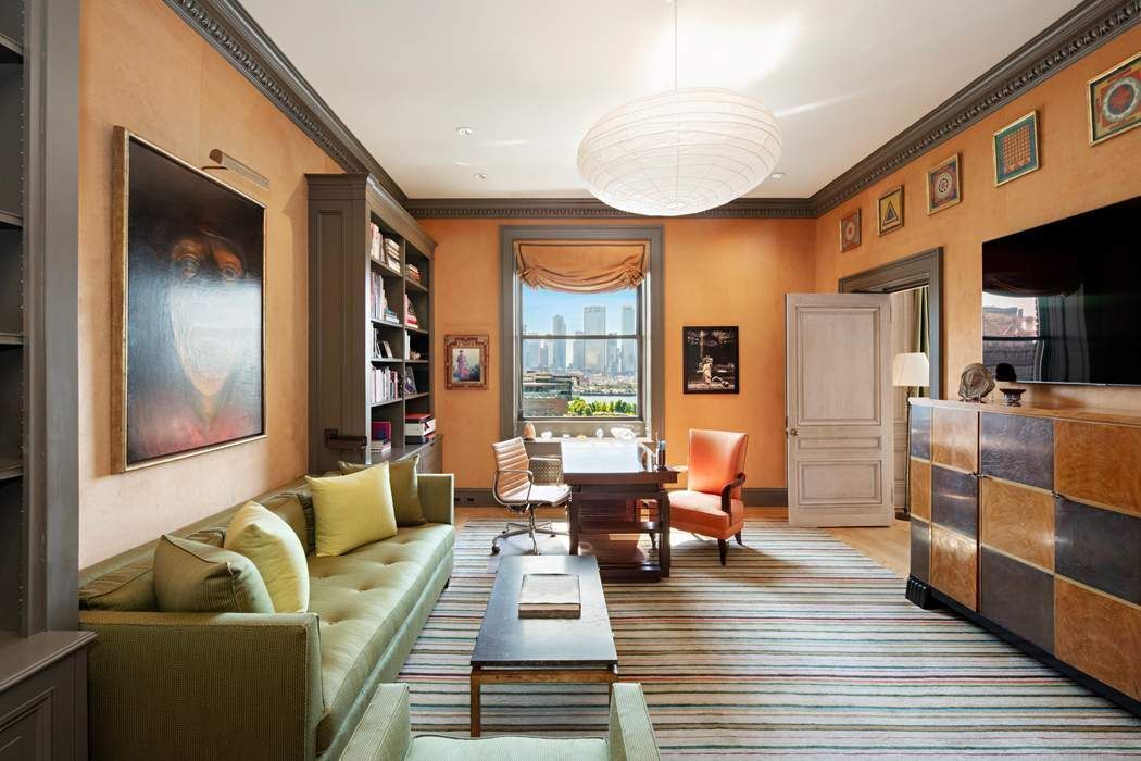 1 Sutton Place South, Unit 7C Manhattan, NY 10022 - Photo 8 of 16 a living room with furniture wooden floor and a large window