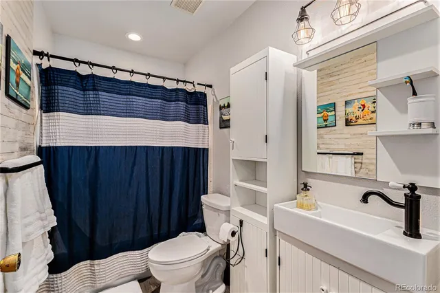 a view of a dining room with furniture and a window