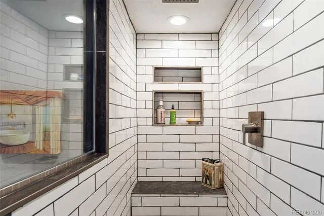 a view of a patio with couches table and chairs and potted plants