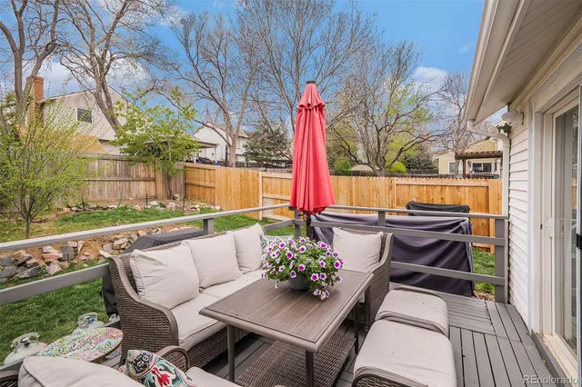 a view of a house with backyard porch and sitting area