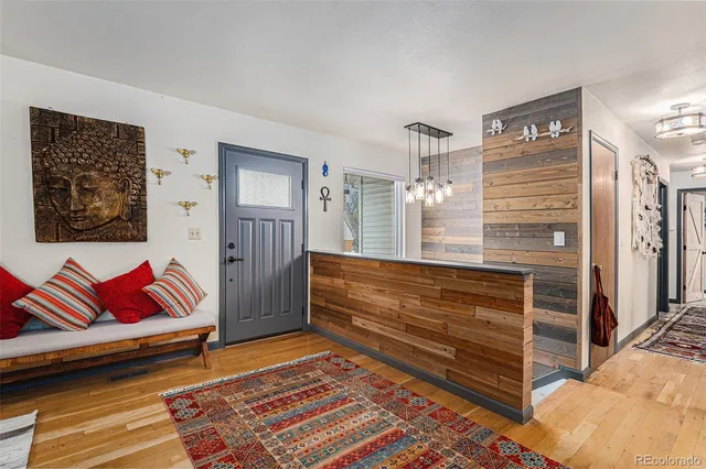 a room with stairs and a rug