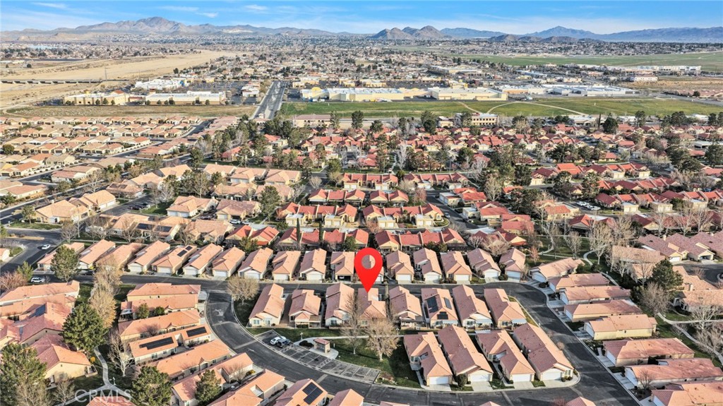 19055 Stoddard Way Apple Valley, CA 92308 - Photo 40 of 44 an aerial view of residential houses with outdoor space