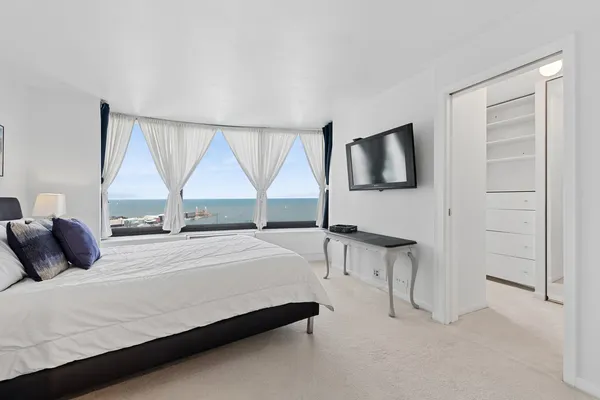 a bedroom with a bed and window