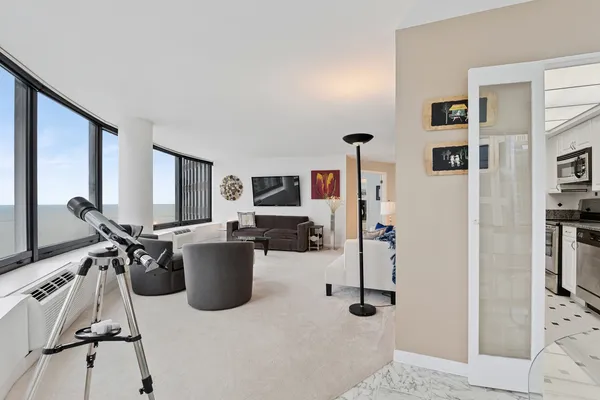 a room with gym equipment and a flat screen tv