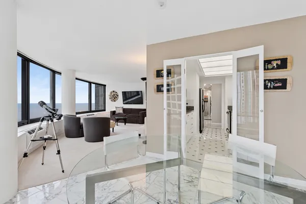 a large room with a couch and a view of living room