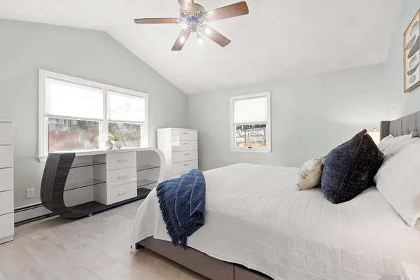 a bedroom with a bed and window