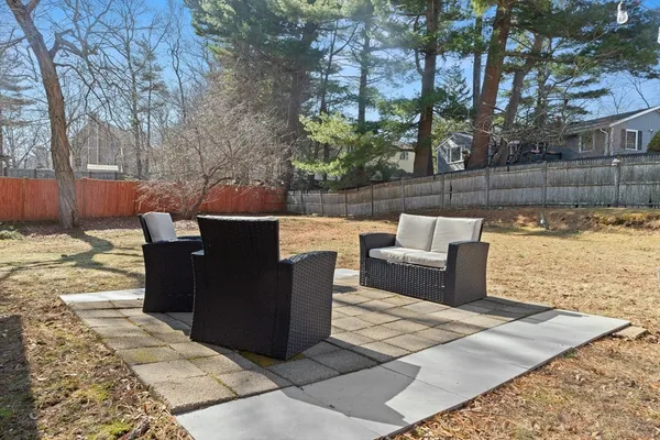 a view of a terrace with couches and a fire pit