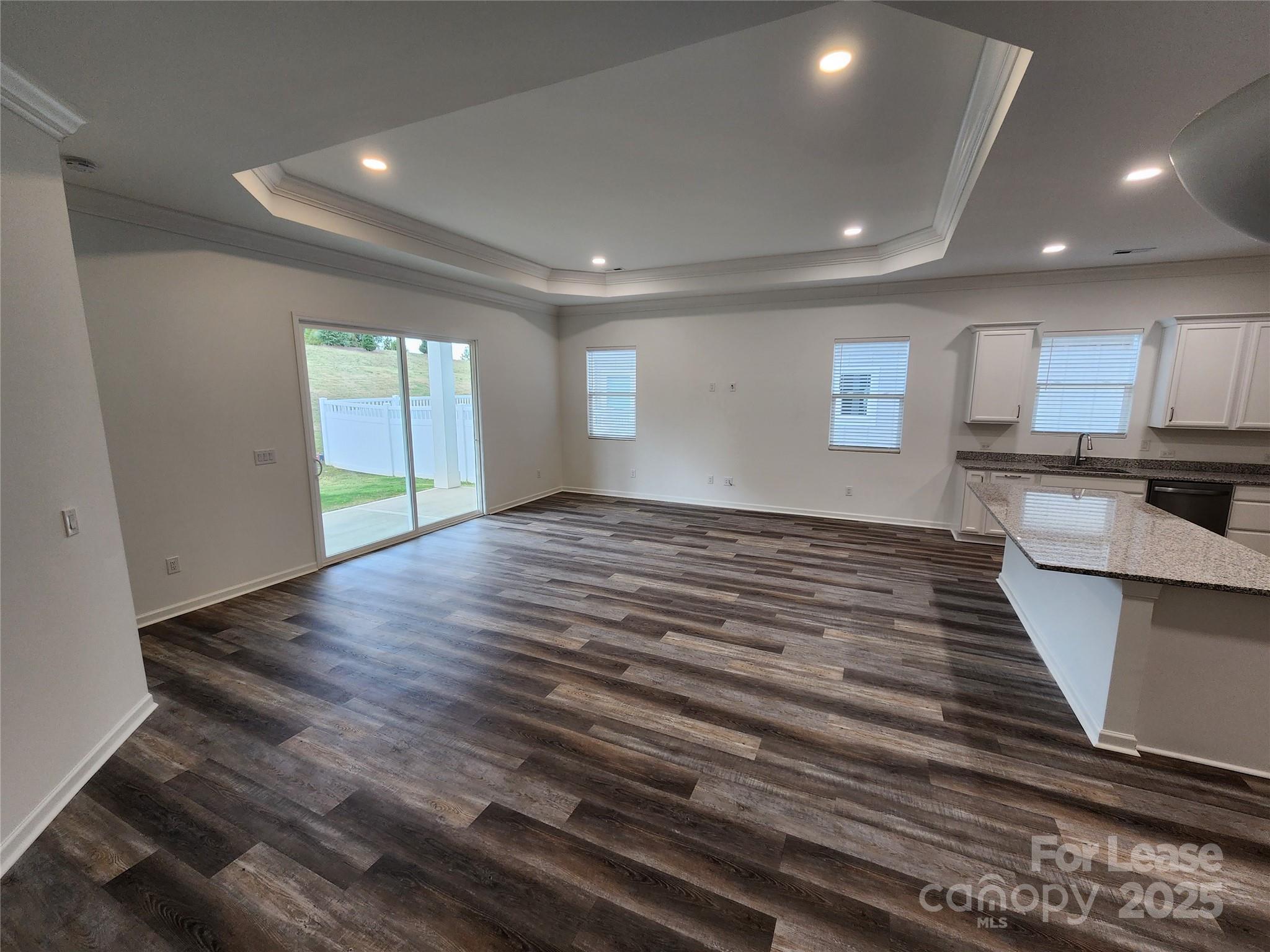 6654 Star Drive, Unit 8 Sherrills Ford, NC 28673 - Photo 4 of 7 an empty room with wooden floor and windows