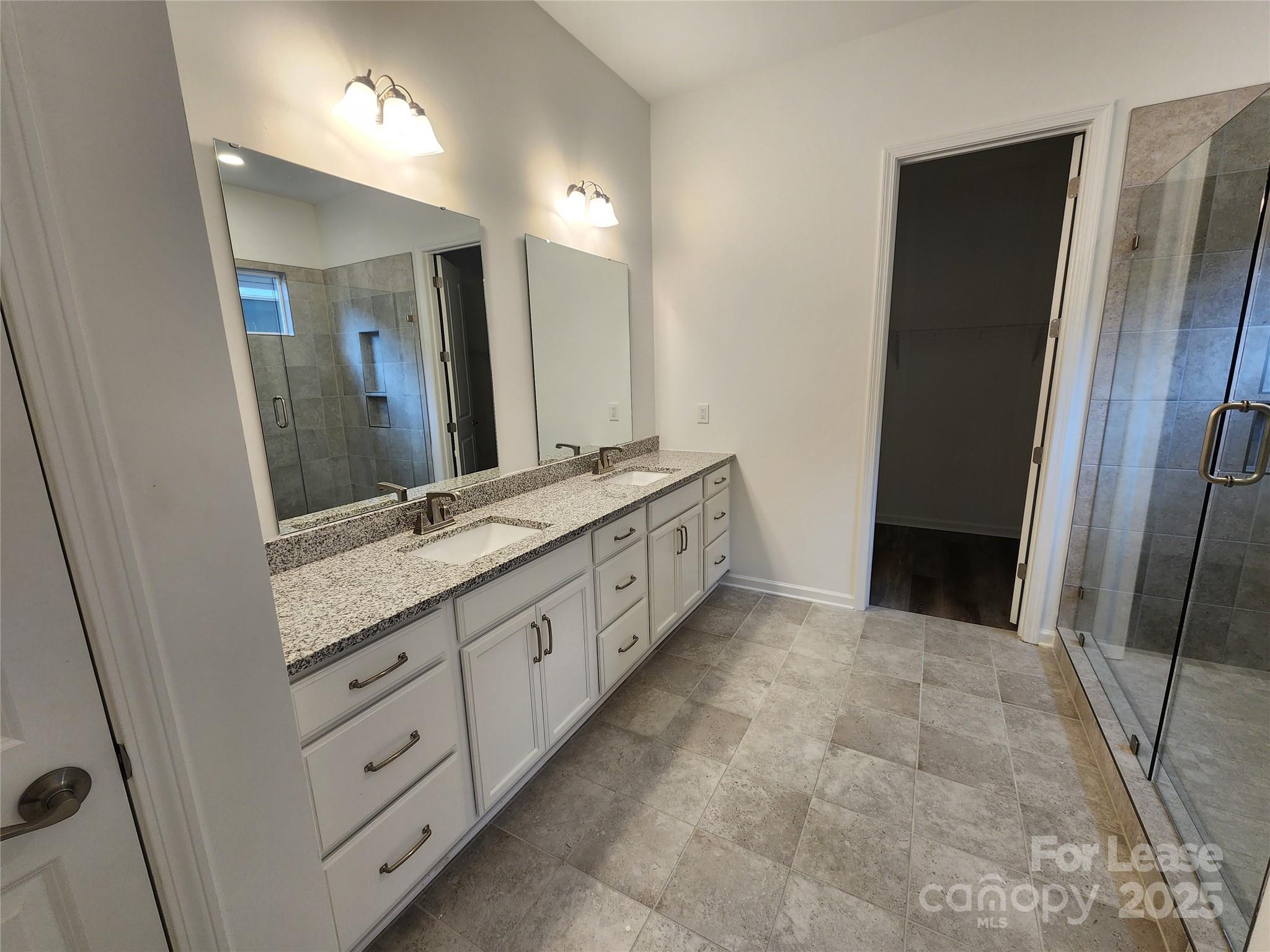 6654 Star Drive, Unit 8 Sherrills Ford, NC 28673 - Photo 6 of 7 a spacious bathroom with a double vanity sink and a mirror