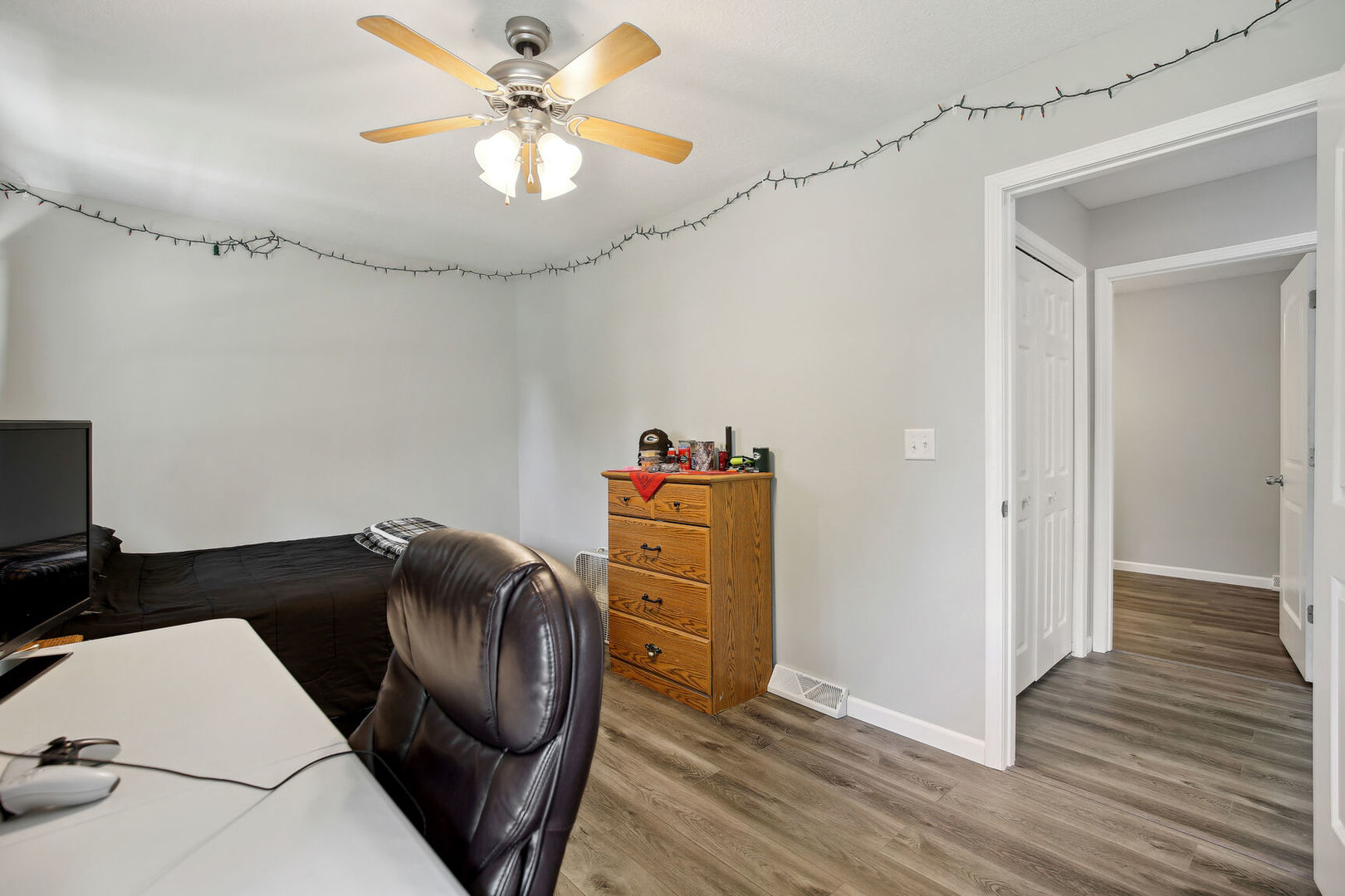 119 South Maple Street Paxton, IL 60957 - Photo 14 of 22 a bedroom with a bed and a chandelier