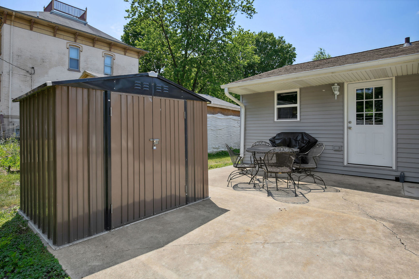 119 South Maple Street Paxton, IL 60957 - Photo 19 of 22 a view of backyard with a table and chairs