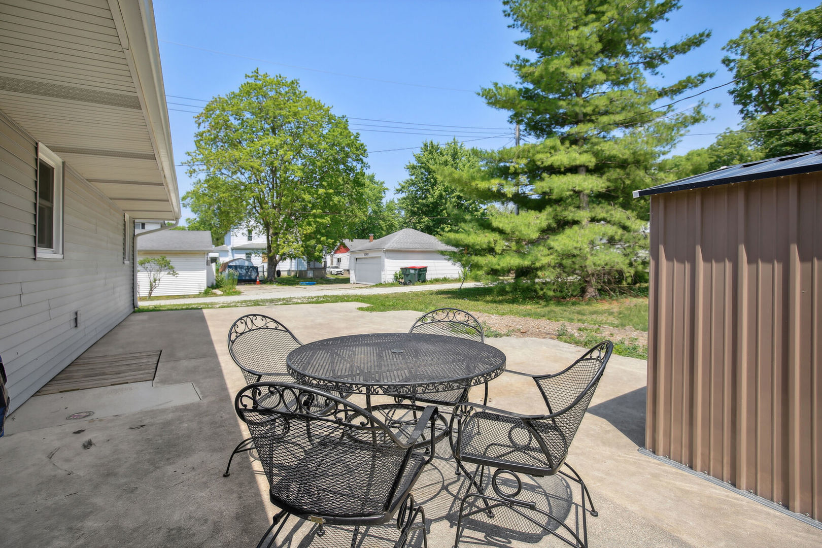 119 South Maple Street Paxton, IL 60957 - Photo 20 of 22 a view of outdoor dining space with a table and chairs