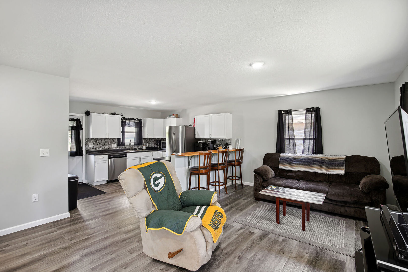 119 South Maple Street Paxton, IL 60957 - Photo 7 of 22 a living room with furniture and a book shelf