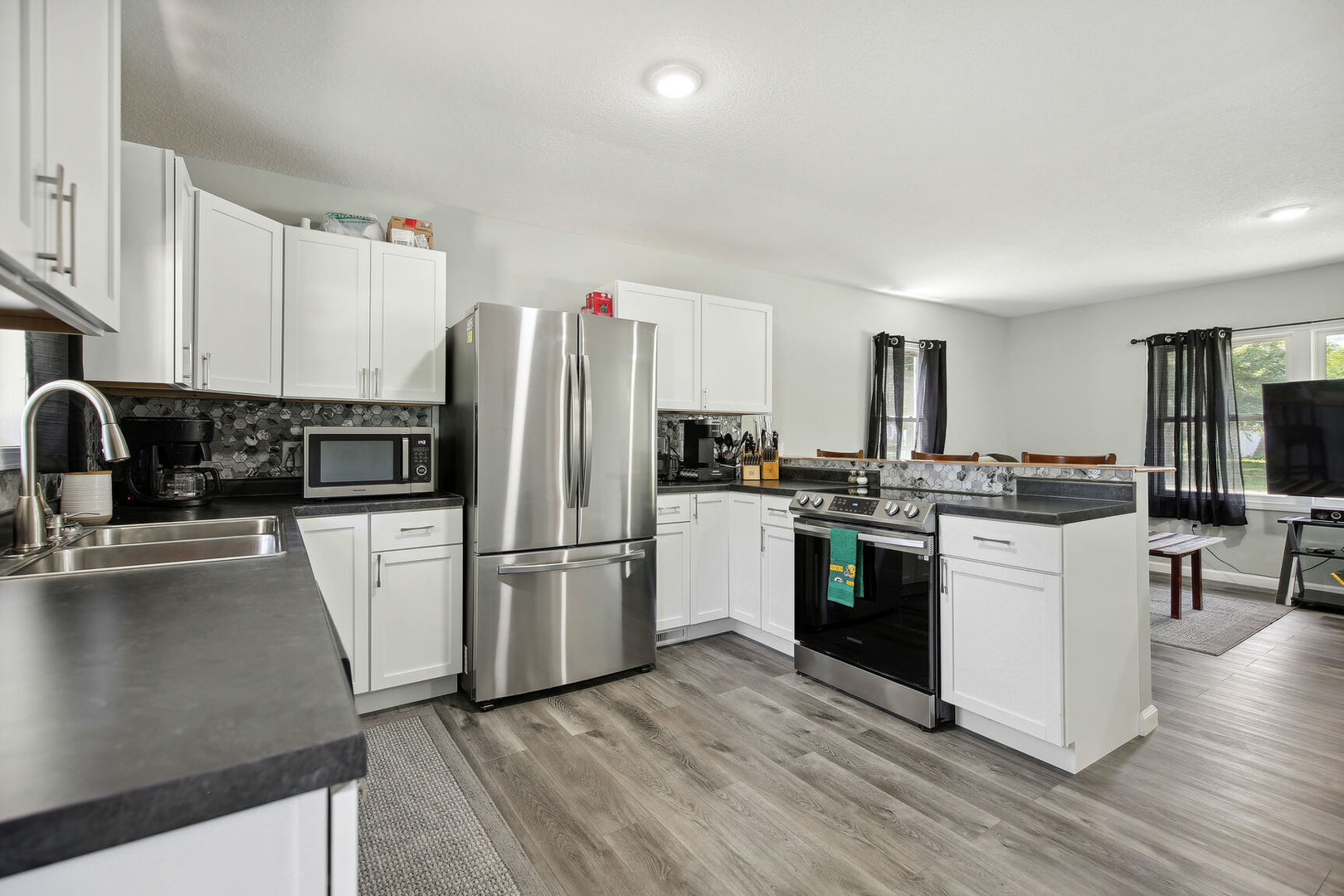 119 South Maple Street Paxton, IL 60957 - Photo 9 of 22 a kitchen with a refrigerator stove and sink
