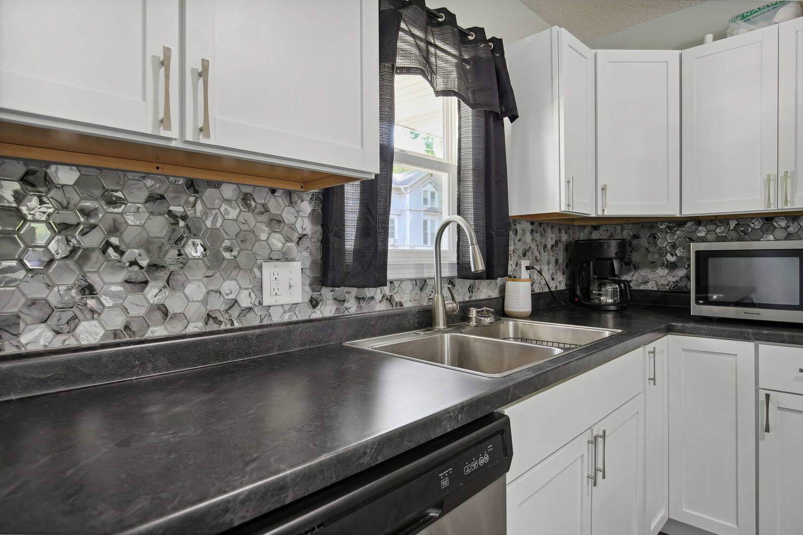 119 South Maple Street Paxton, IL 60957 - Photo 10 of 22 a kitchen with a sink and cabinets
