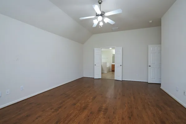 a view of an empty room with a window