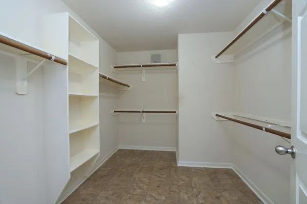 a view of an empty walk in closet