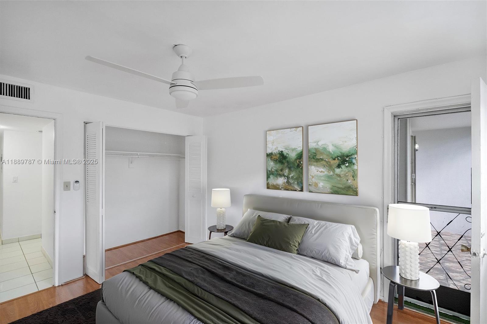 8107 Southwest 72nd Avenue, Unit 201E Miami, FL 33143 - Photo 15 of 29 a bedroom with a large bed and a window