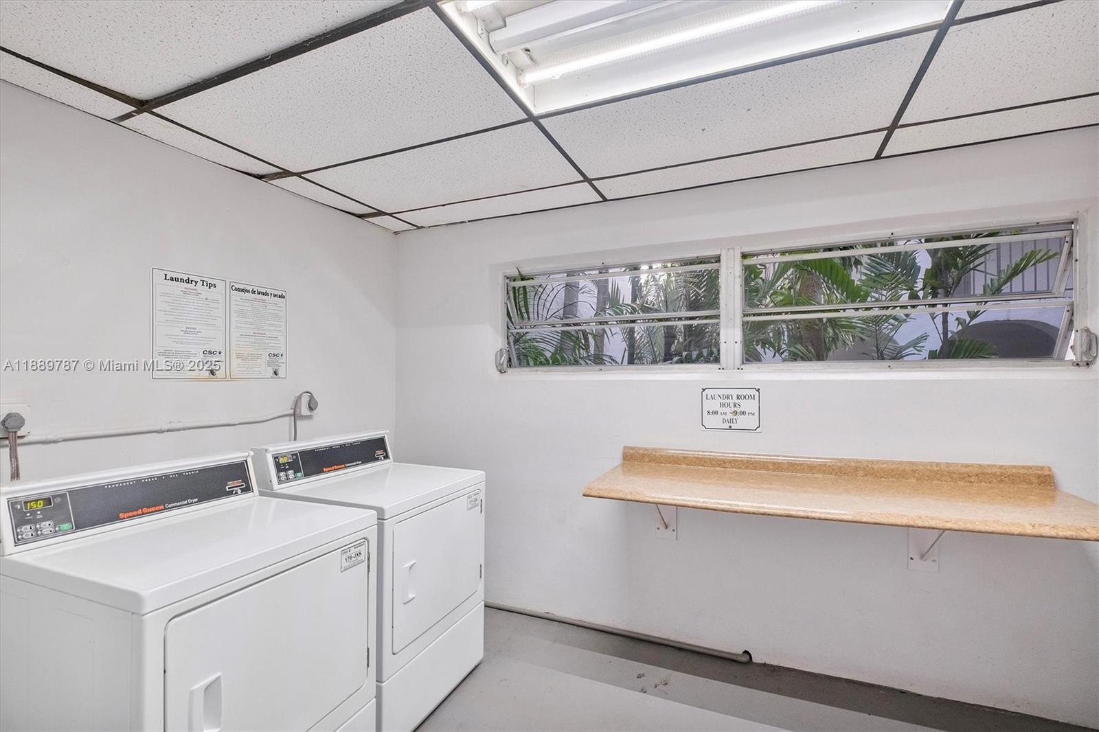 8107 Southwest 72nd Avenue, Unit 201E Miami, FL 33143 - Photo 19 of 29 a utility room with dryer and washer