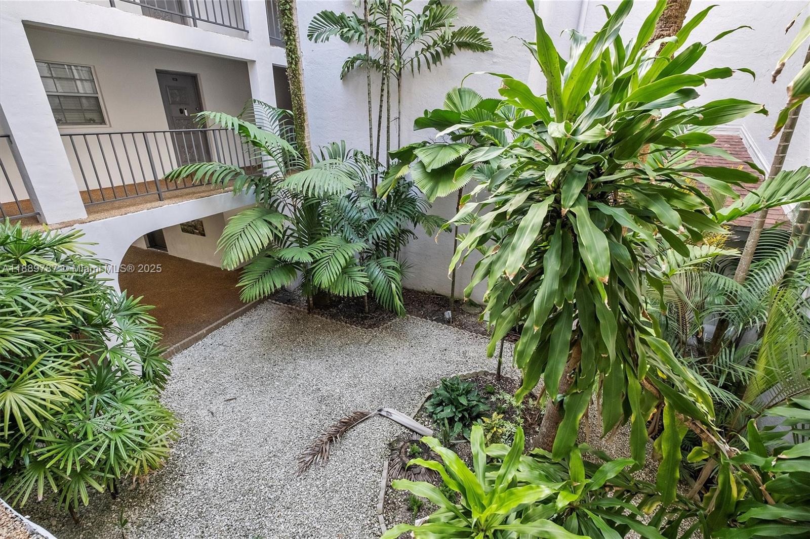 8107 Southwest 72nd Avenue, Unit 201E Miami, FL 33143 - Photo 22 of 29 a house with a plant in front of it