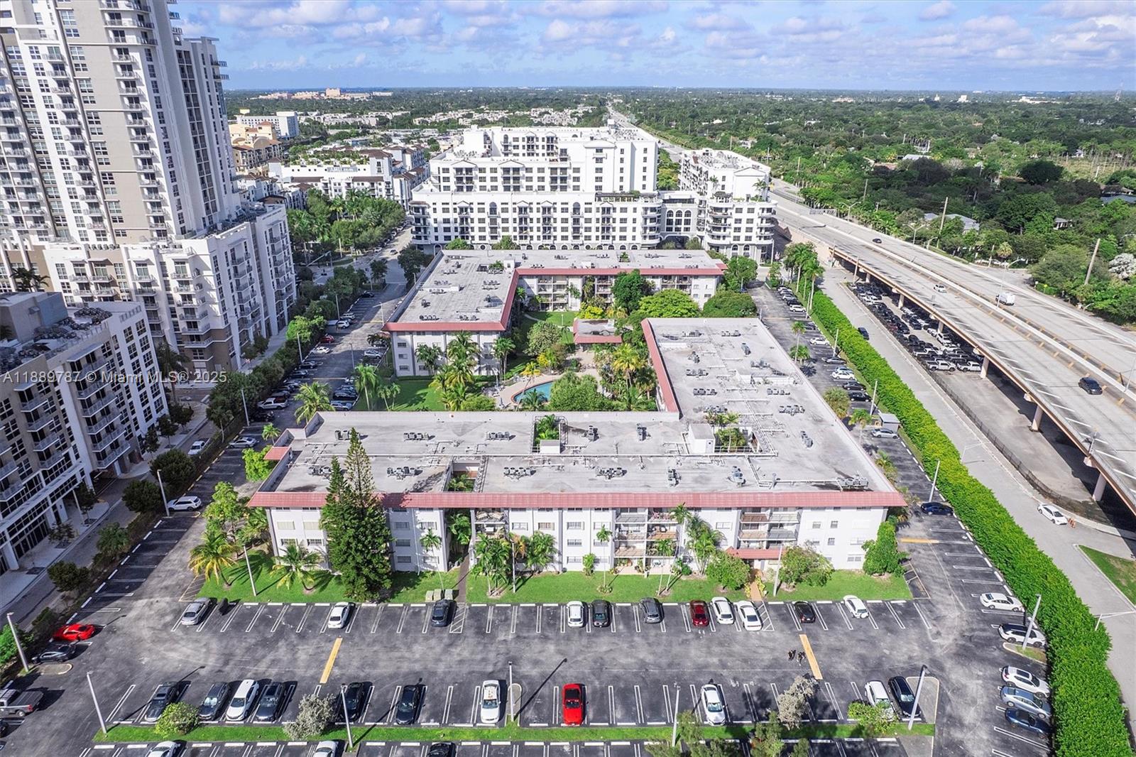 8107 Southwest 72nd Avenue, Unit 201E Miami, FL 33143 - Photo 25 of 29 a view of city with tall buildings