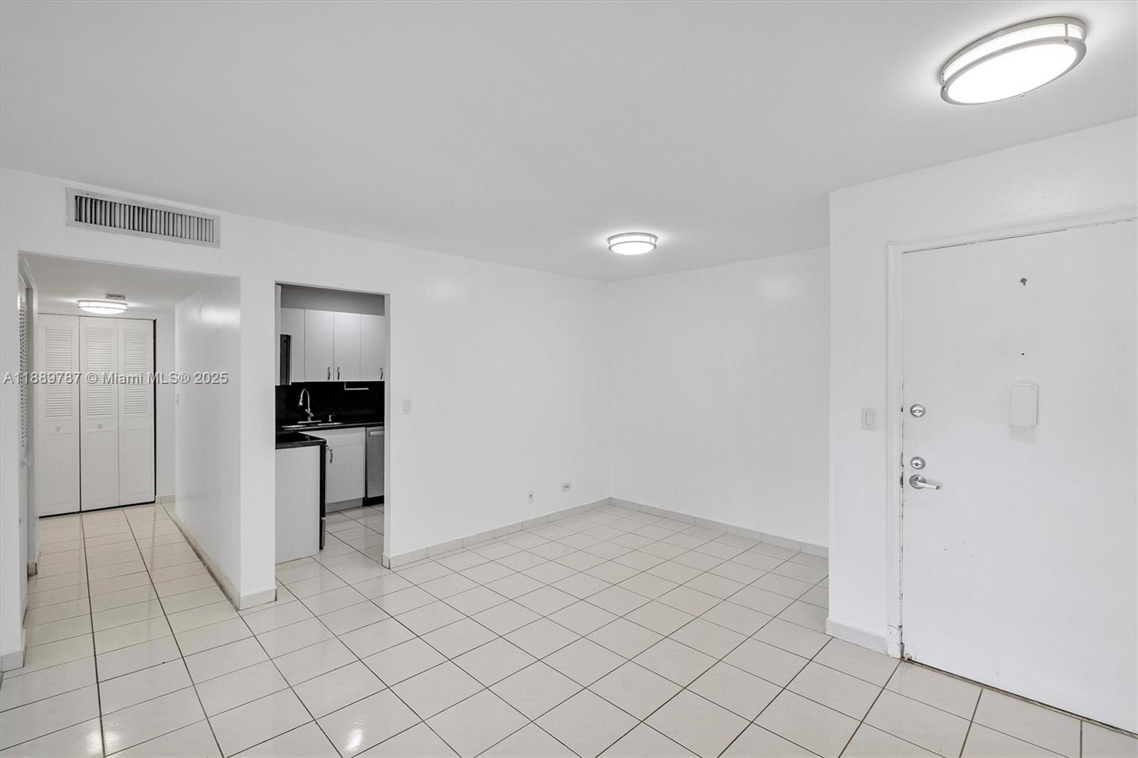 8107 Southwest 72nd Avenue, Unit 201E Miami, FL 33143 - Photo 4 of 29 a view of kitchen with refrigerator and cabinets