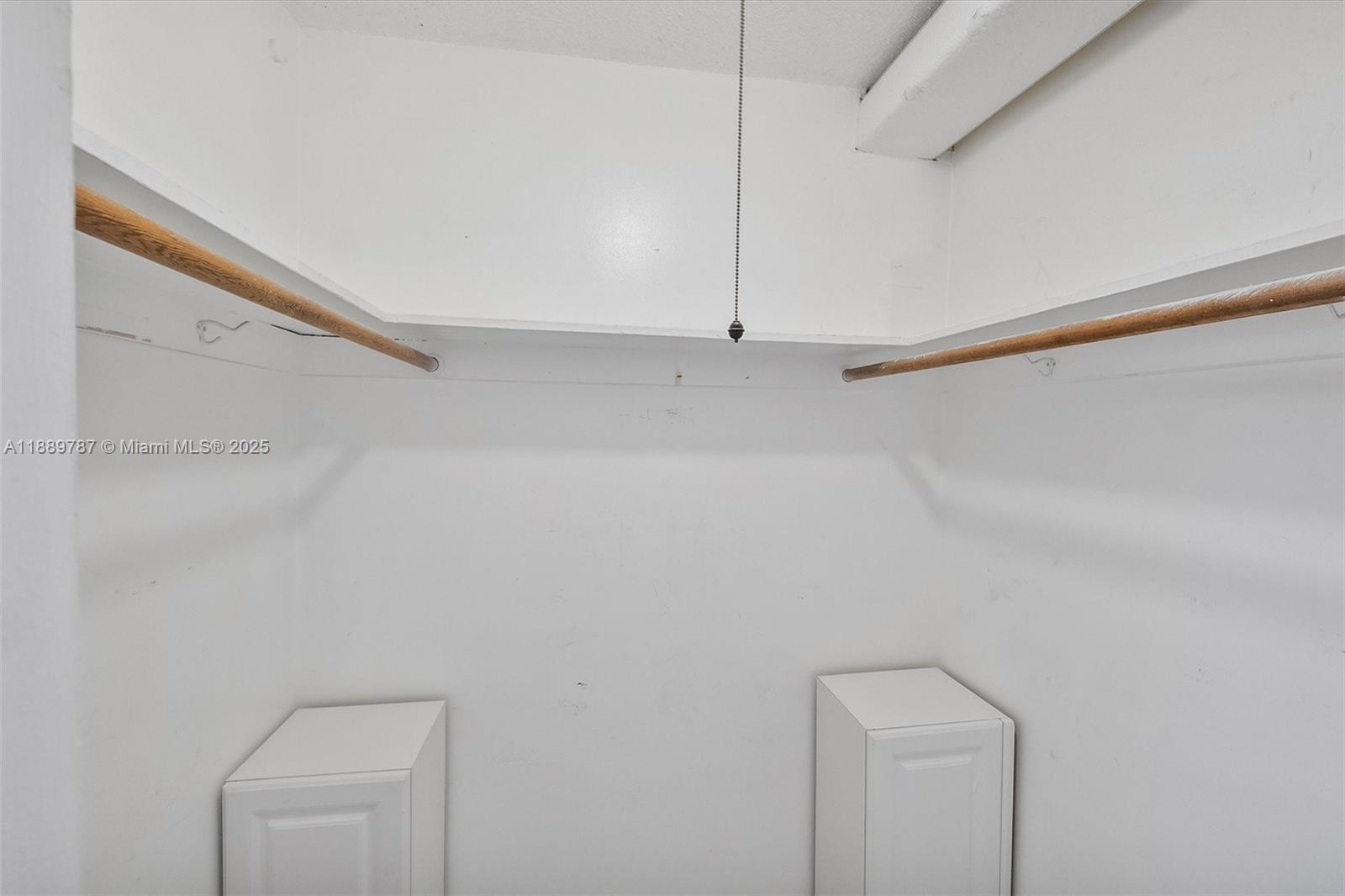 8107 Southwest 72nd Avenue, Unit 201E Miami, FL 33143 - Photo 8 of 29 a view of an empty walk in closet