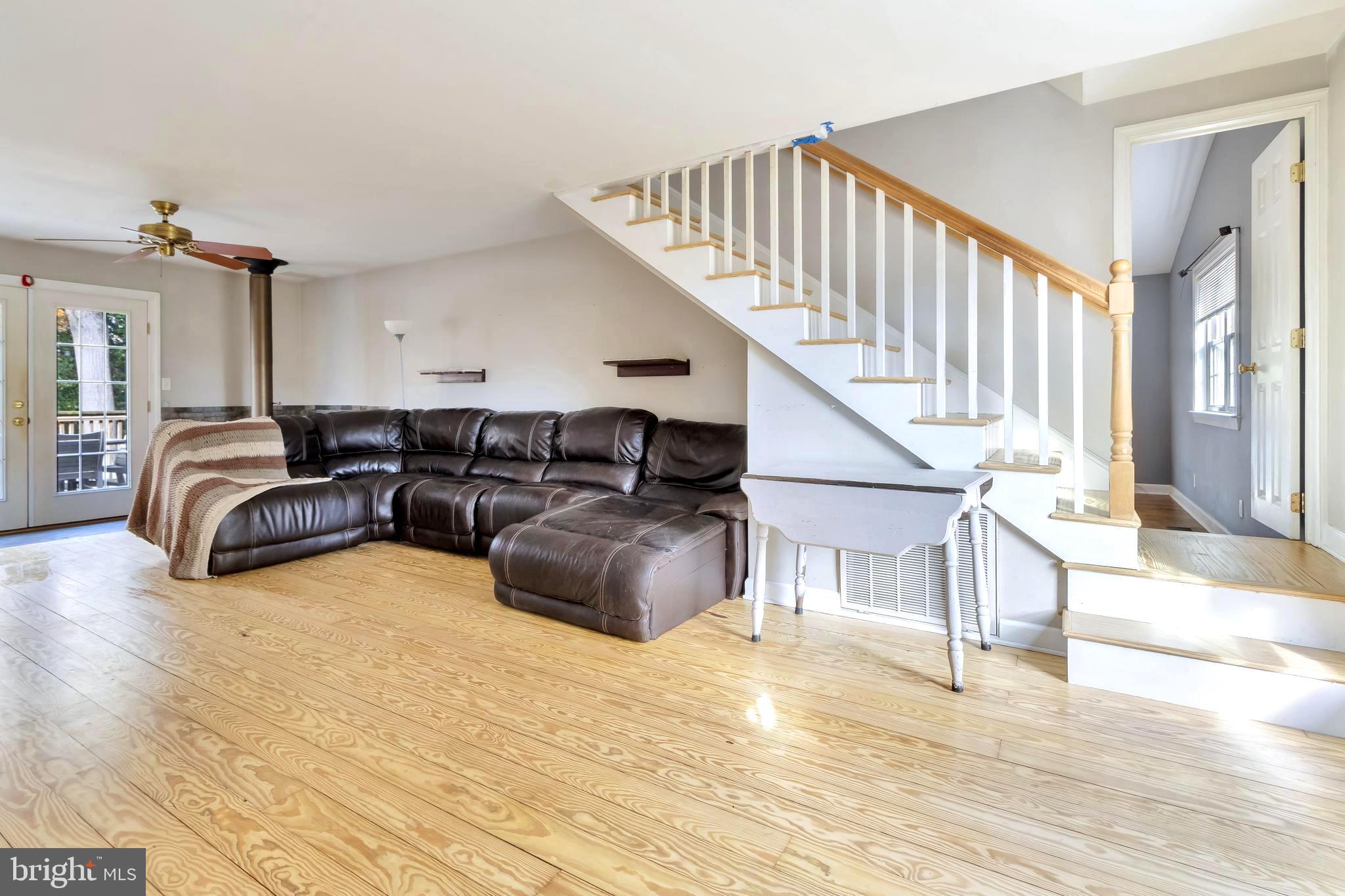 18526 Cool Spring Road Milton, DE 19968 - Photo 14 of 70 a living room with furniture and a chandelier