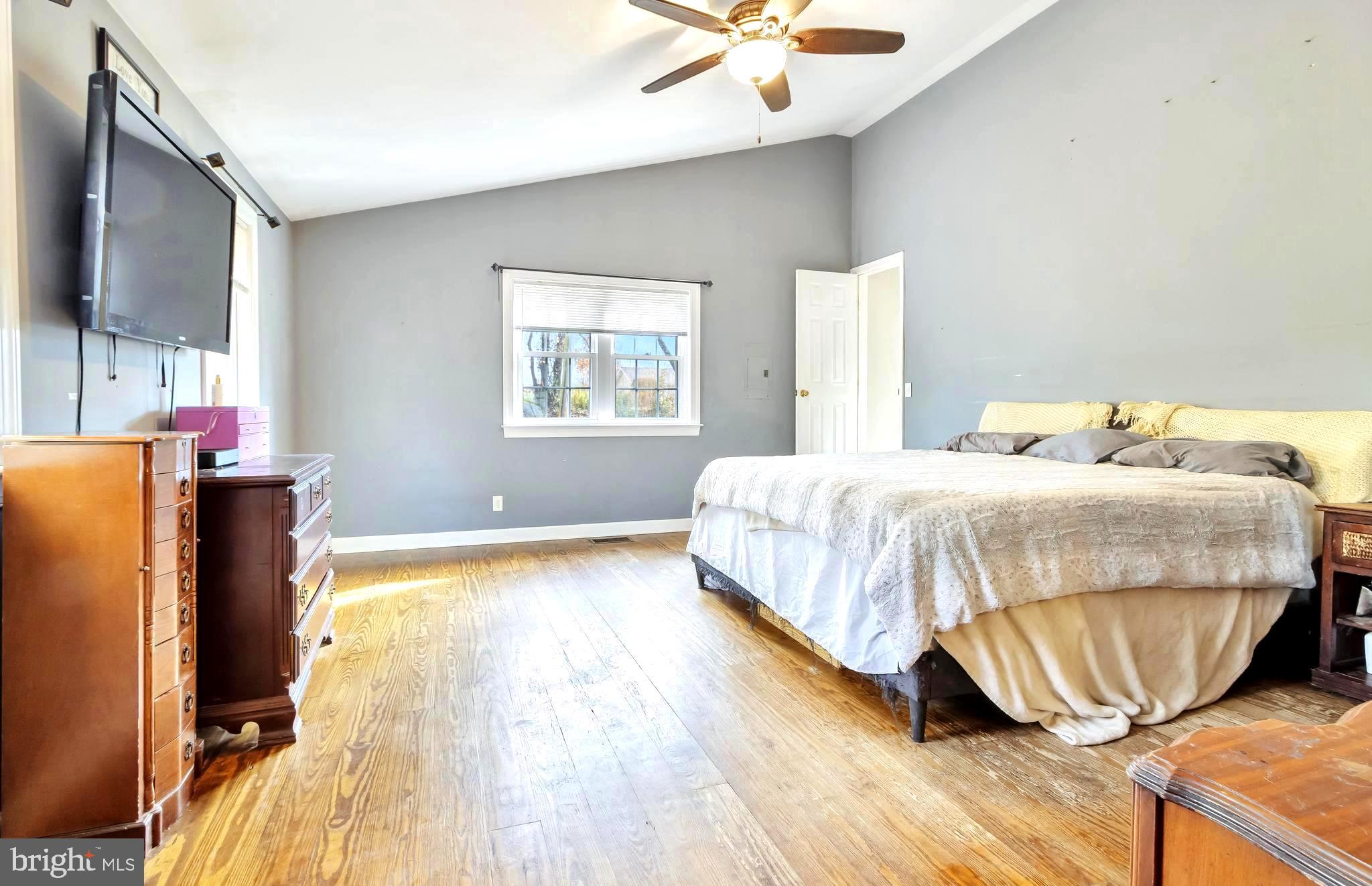 18526 Cool Spring Road Milton, DE 19968 - Photo 18 of 70 a bedroom with a bed and wooden floor