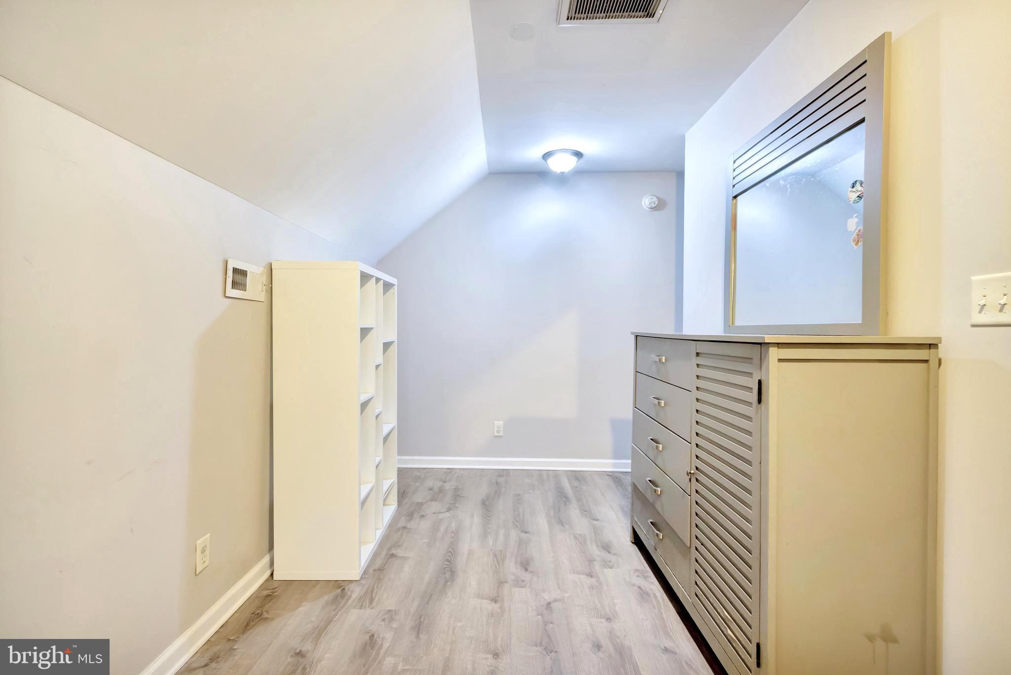 18526 Cool Spring Road Milton, DE 19968 - Photo 20 of 70 a view of a hallway with wooden floor and staircase