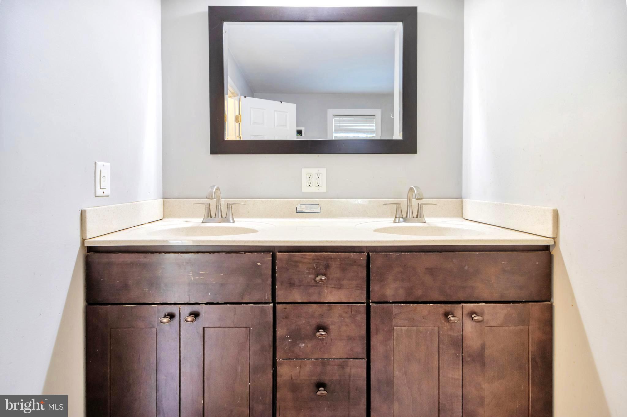 18526 Cool Spring Road Milton, DE 19968 - Photo 22 of 70 a bathroom with a sink and a mirror