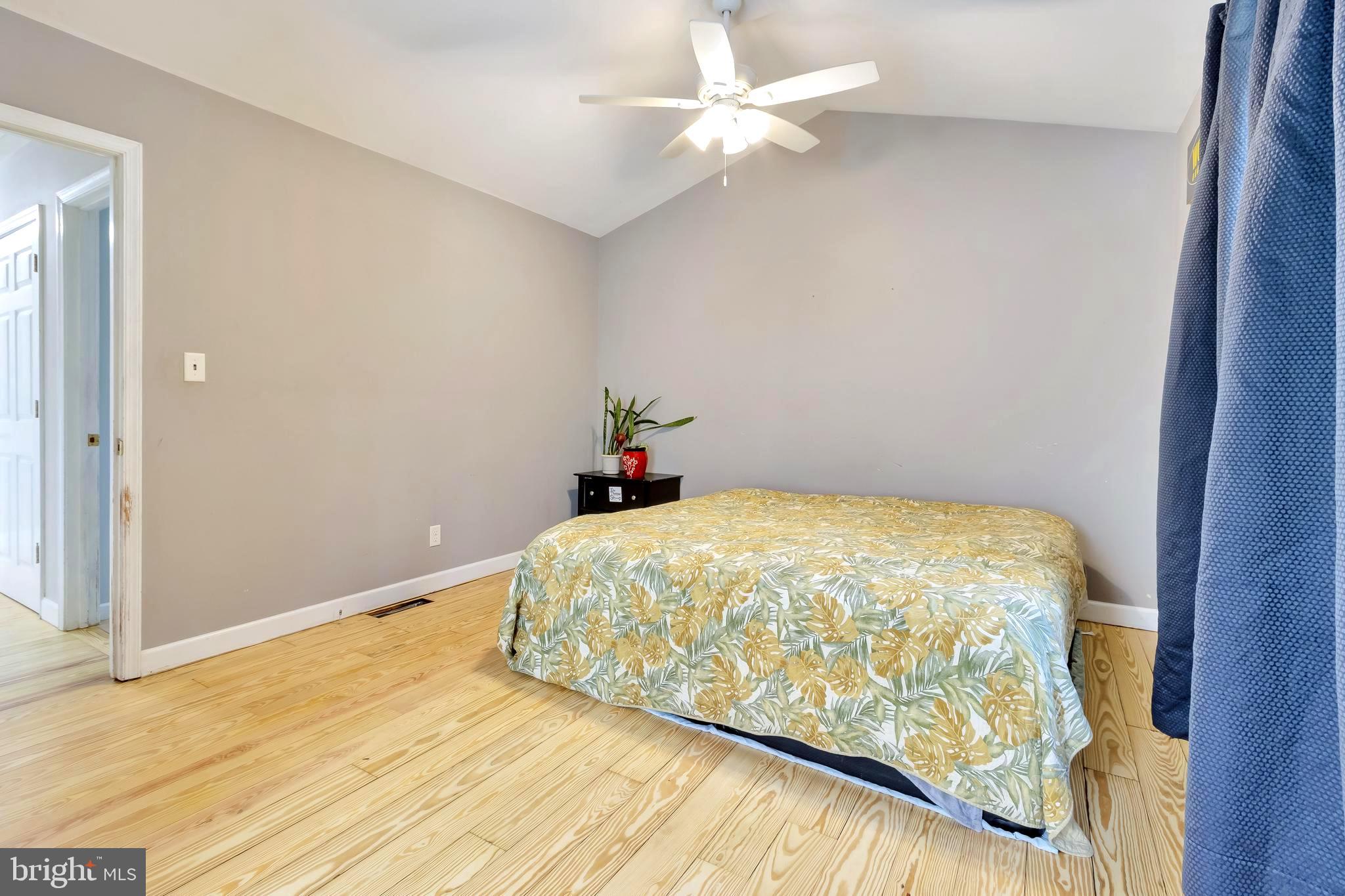18526 Cool Spring Road Milton, DE 19968 - Photo 28 of 70 a bedroom with a bed and a ceiling fan