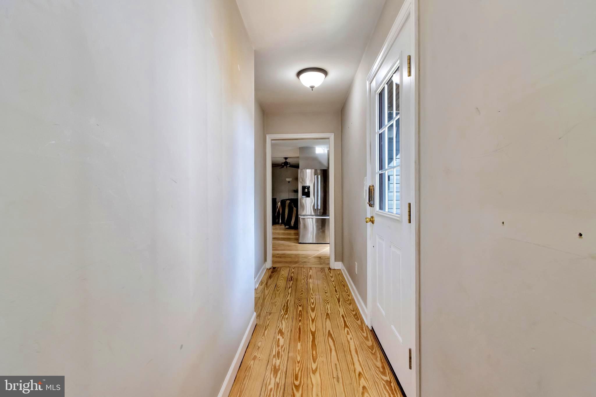 18526 Cool Spring Road Milton, DE 19968 - Photo 31 of 70 a view of a hallway with wooden floor
