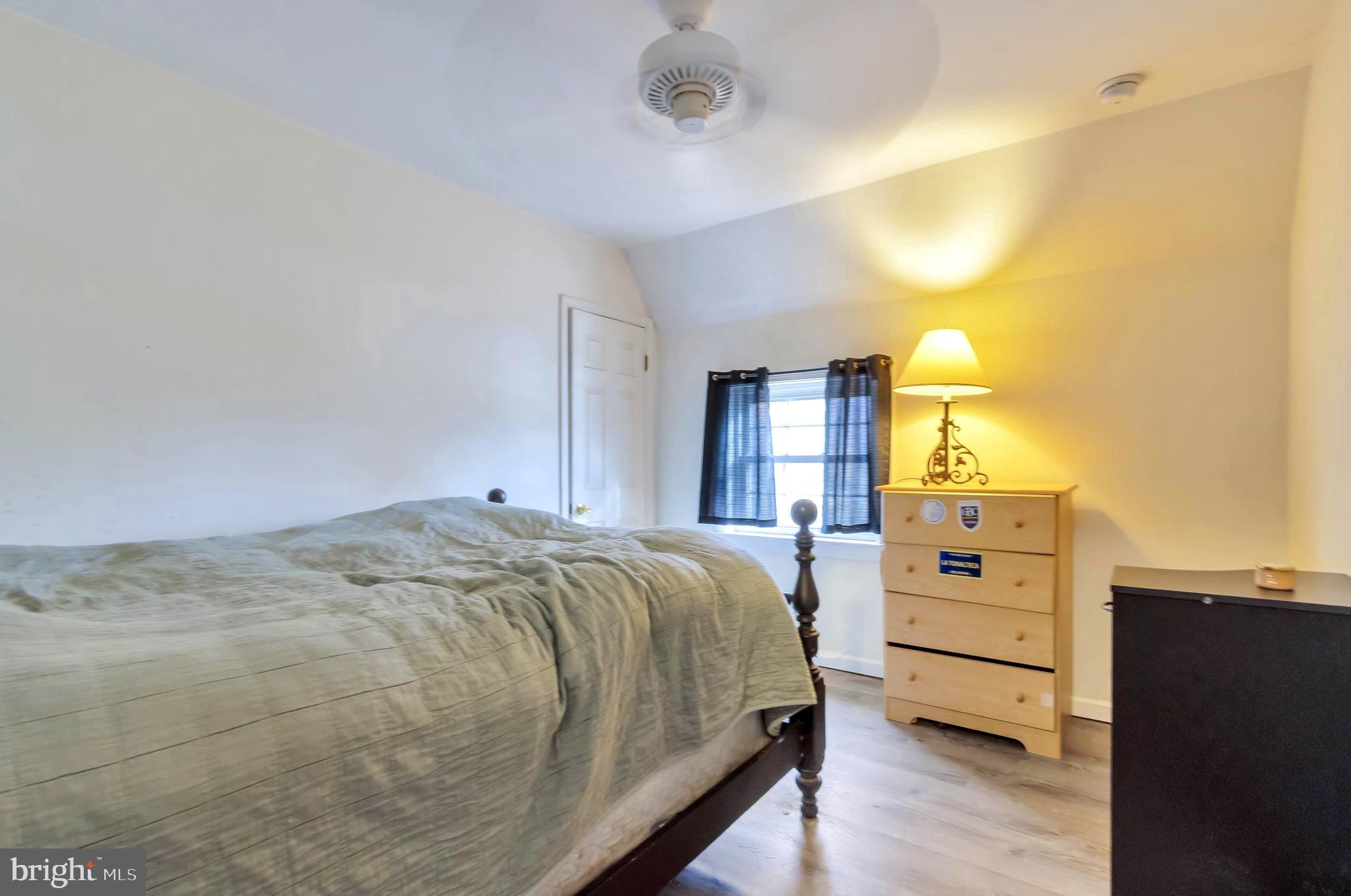 18526 Cool Spring Road Milton, DE 19968 - Photo 35 of 70 a bedroom with a bed and cabinets