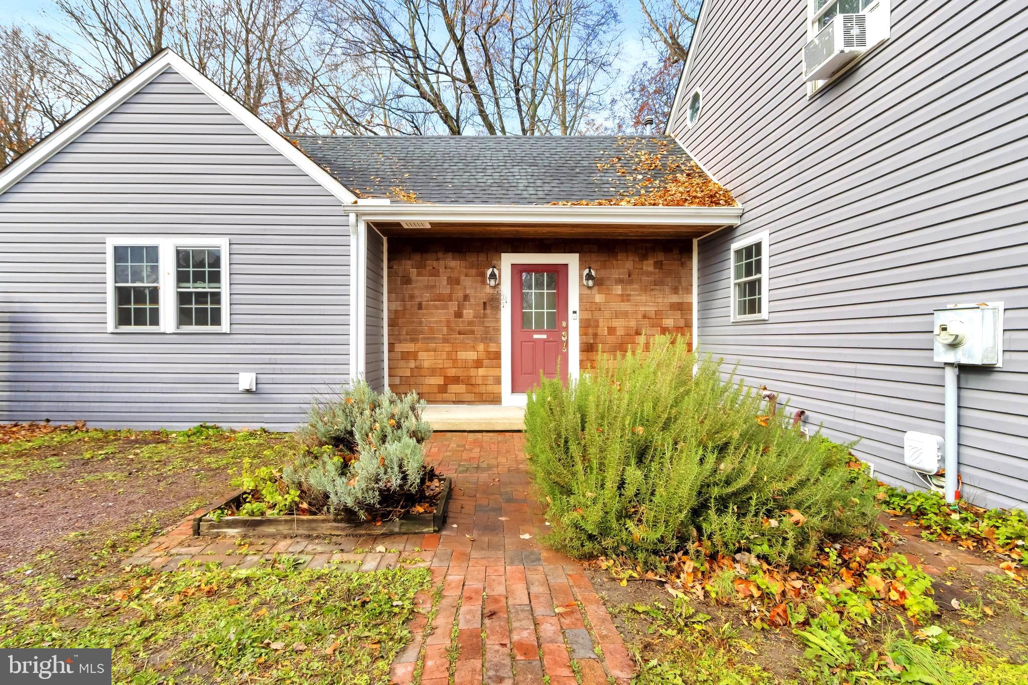 18526 Cool Spring Road Milton, DE 19968 - Photo 4 of 70 a front view of a house with a yard