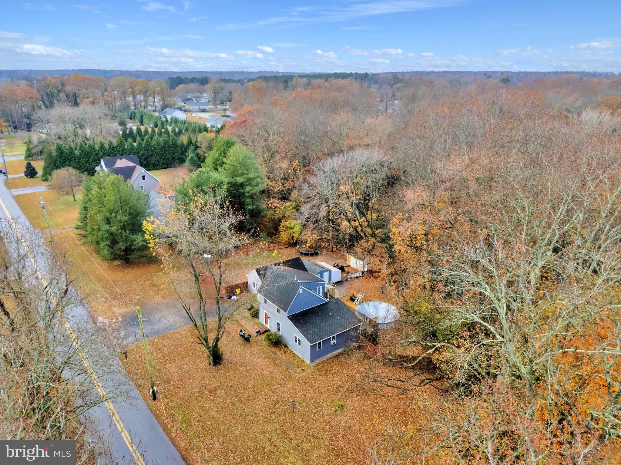 18526 Cool Spring Road Milton, DE 19968 - Photo 60 of 70 an aerial view of a house with a yard and lake view