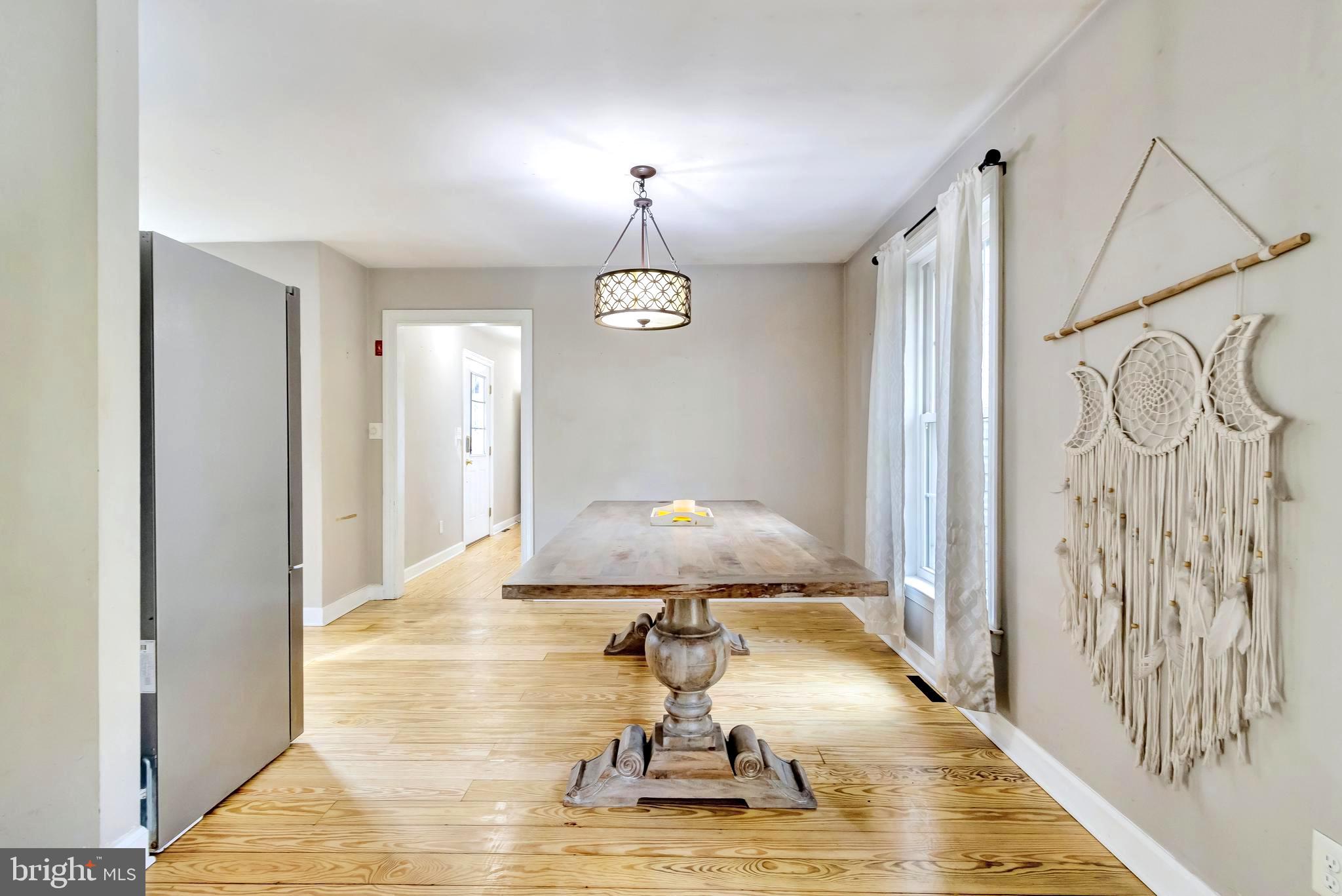 18526 Cool Spring Road Milton, DE 19968 - Photo 6 of 70 a living room with a chandelier furniture and a window