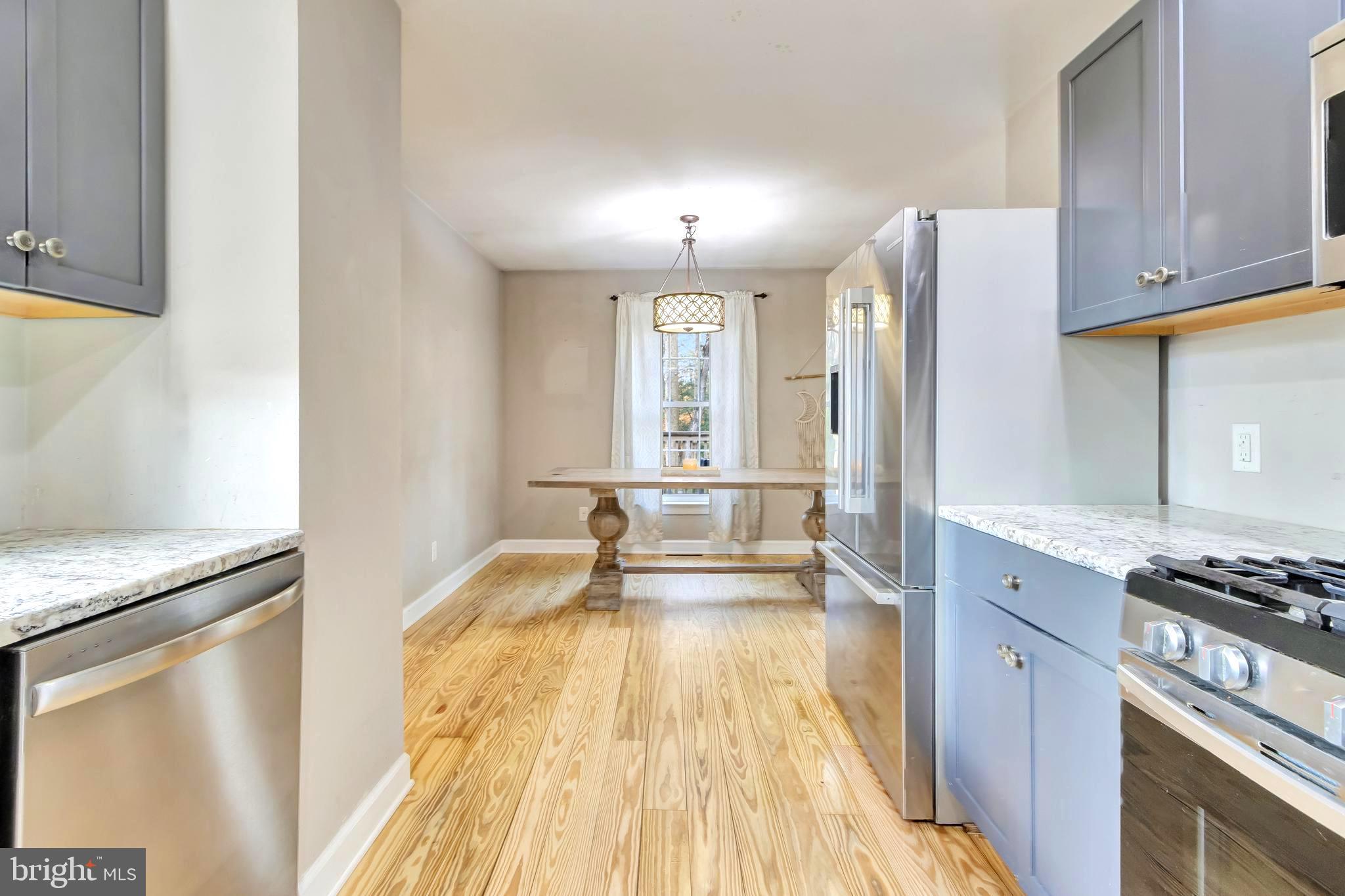 18526 Cool Spring Road Milton, DE 19968 - Photo 8 of 70 a spacious bathroom with a granite countertop tub sink and mirror